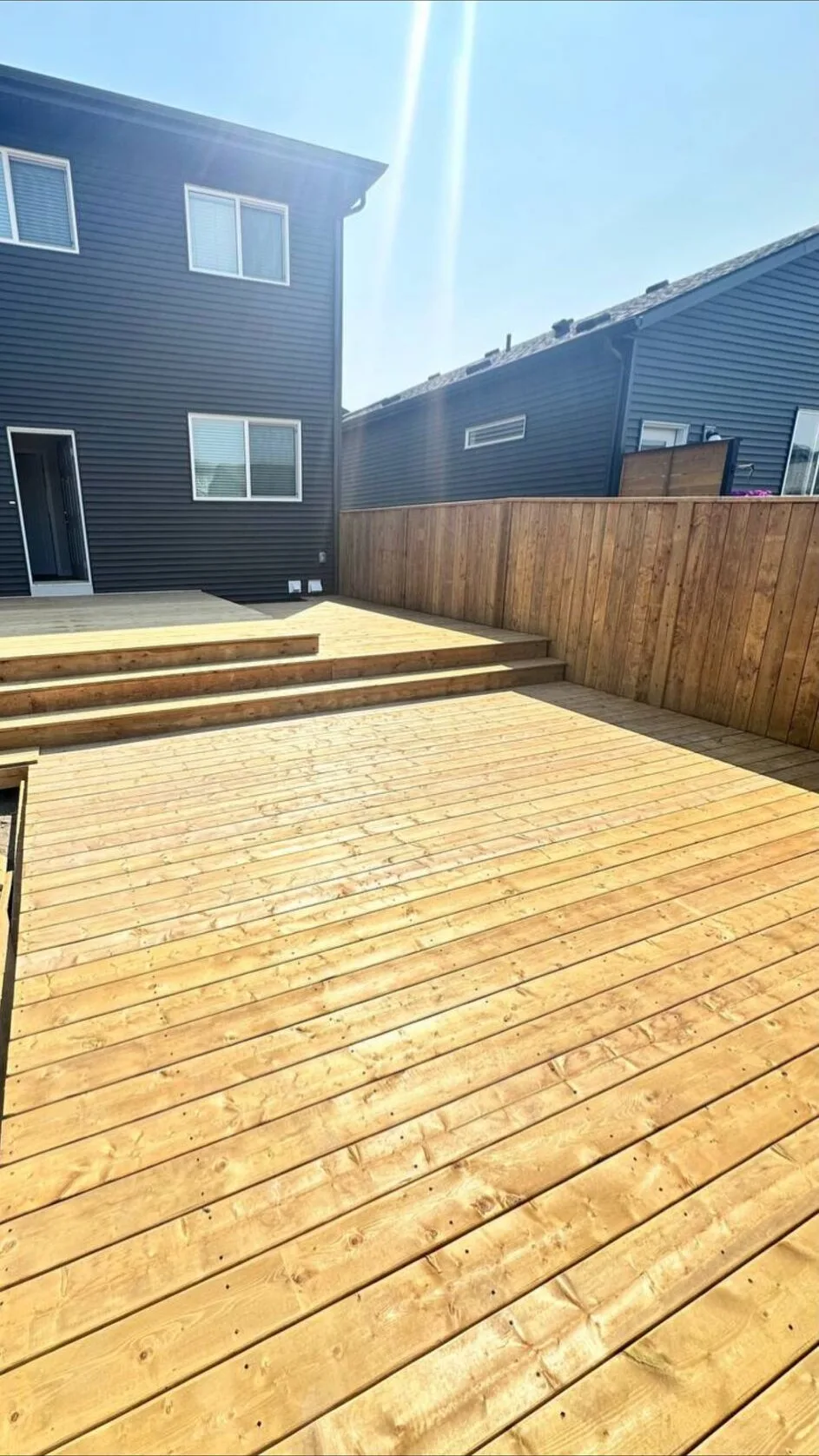 Wood deck platform with steps built by Apex Exterior Works